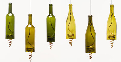 Wine Bottle Lamps Lighten up a room or patio with this unique look. To get it yourself, you'll need something like a steel cable to hang it from and a spiral (or other adornment) to peek out from the …