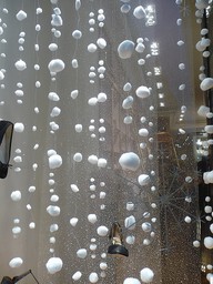 Thread cotton balls to make fake snow. >> SO cute for windows or for show displays!
