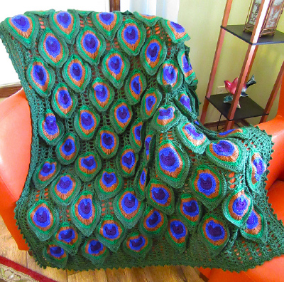 http://www.ravelry.com/patterns/library/birds-of-a-feather-peacock-afghan